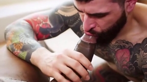 Tattooed bitch likes large dark penis